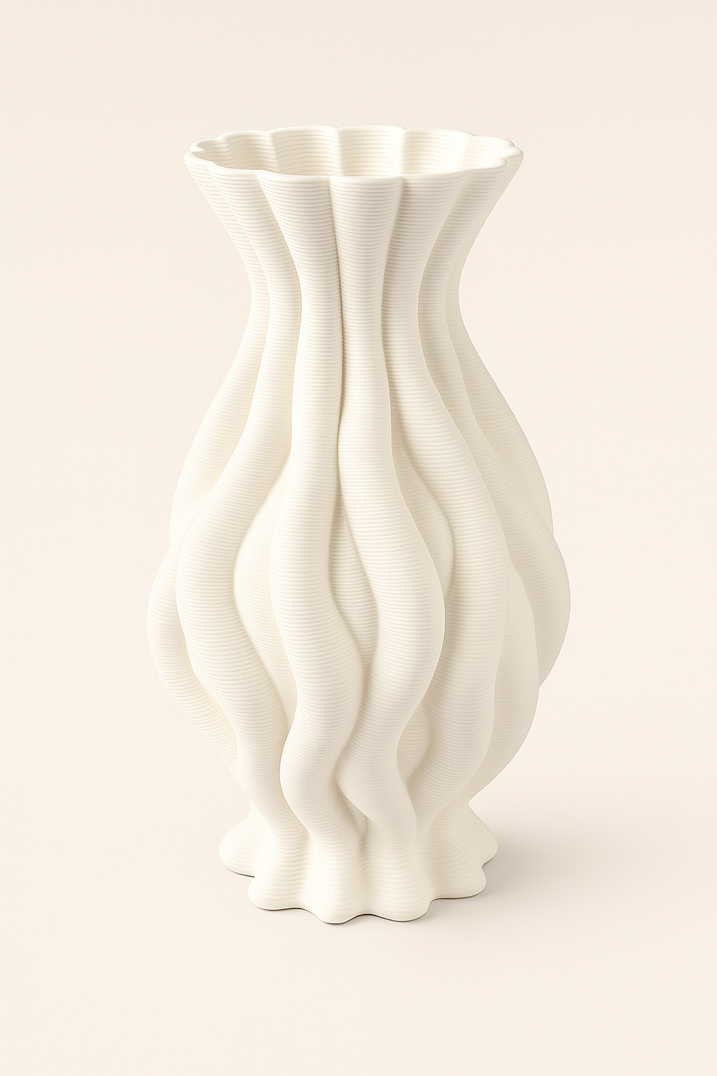 White ceramic vase with wavy design on a beige background